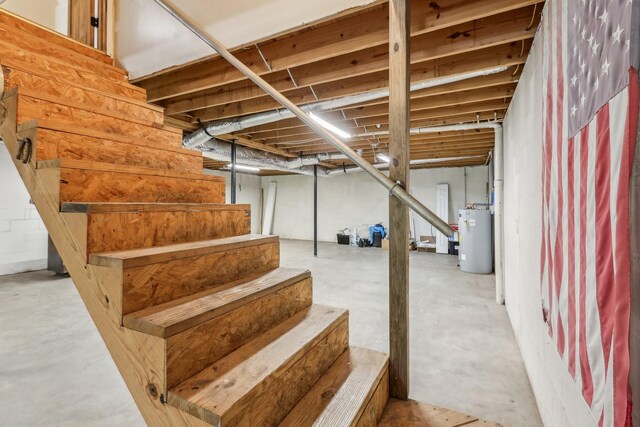 46 Seay Ln, Erin, TN 37061 - unfinished basement featuring gas water heater and stairs