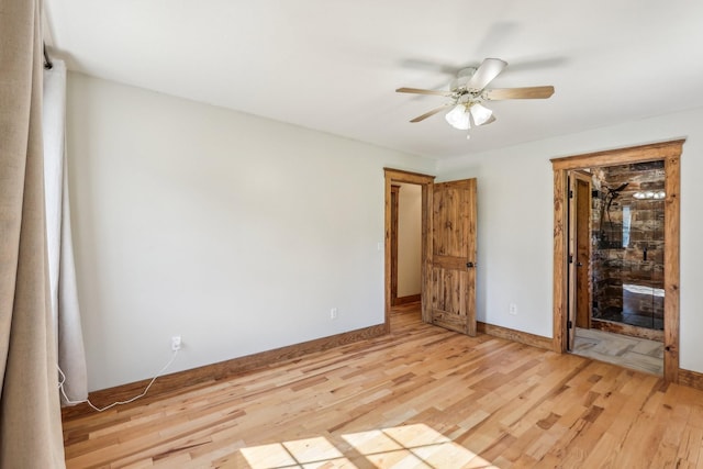46 Seay Ln, Erin, TN 37061 - unfurnished bedroom featuring light wood-style floors, baseboards, and a ceiling fan