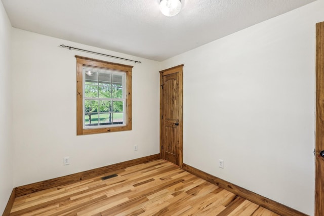 46 Seay Ln, Erin, TN 37061 - empty room with baseboards and light wood-style floors