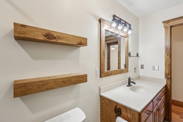 46 Seay Ln, Erin, TN 37061 - bathroom featuring toilet, vanity, and wood finished floors