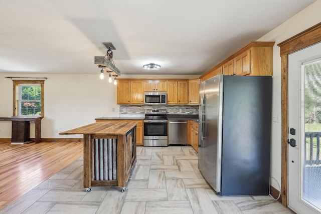 46 Seay Ln, Erin, TN 37061 - kitchen featuring stainless steel appliances, wooden counters, baseboards, decorative backsplash, and light wood finished floors