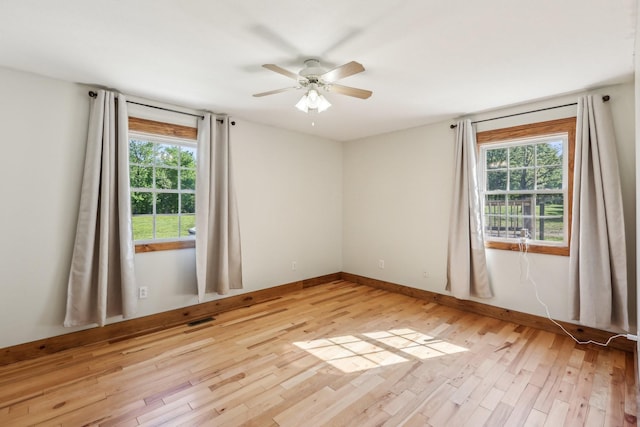 46 Seay Ln, Erin, TN 37061 - spare room featuring light wood-type flooring, healthy amount of natural light, and ceiling fan