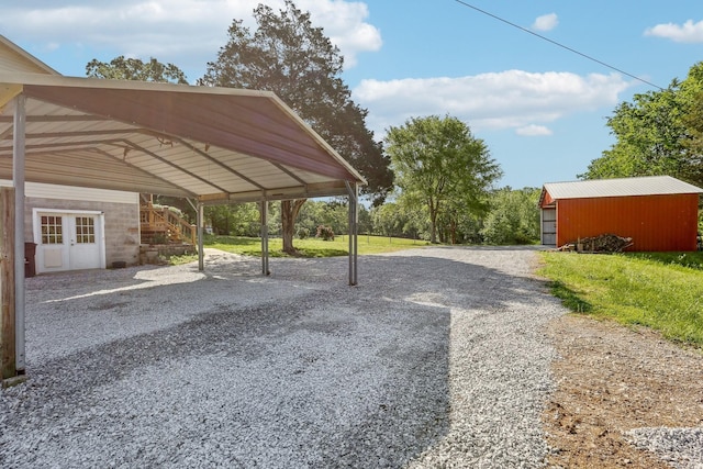 46 Seay Ln, Erin, TN 37061 - view of parking / parking lot featuring gravel driveway and a carport