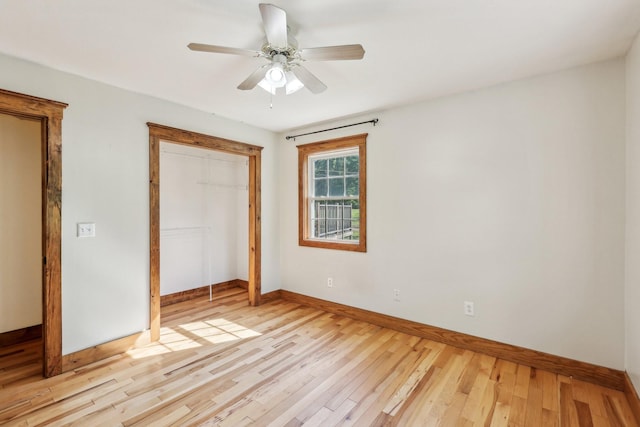 46 Seay Ln, Erin, TN 37061 - unfurnished bedroom featuring baseboards, light wood-style floors, a closet, and ceiling fan