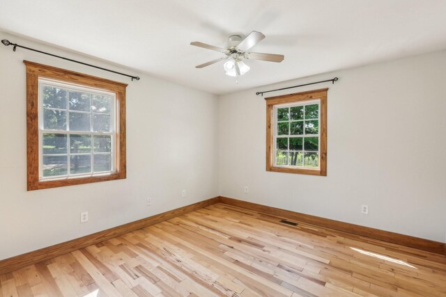 46 Seay Ln, Erin, TN 37061 - unfurnished room with wood finished floors, baseboards, and ceiling fan