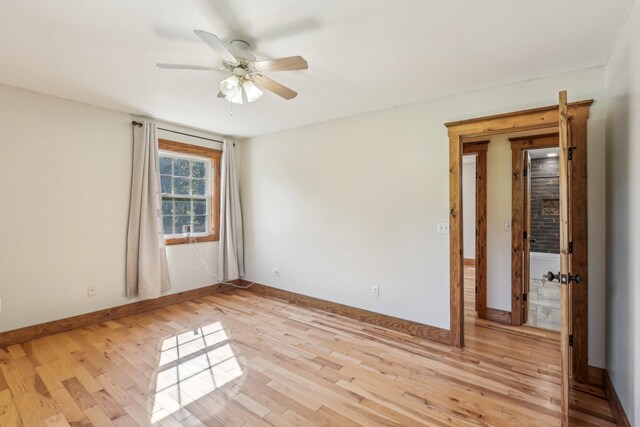 46 Seay Ln, Erin, TN 37061 - empty room with a ceiling fan, light wood-style flooring, and baseboards