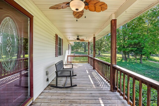 46 Seay Ln, Erin, TN 37061 - deck featuring a ceiling fan, covered porch, and a lawn