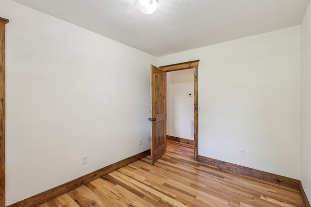 46 Seay Ln, Erin, TN 37061 - spare room featuring baseboards and light wood-style flooring
