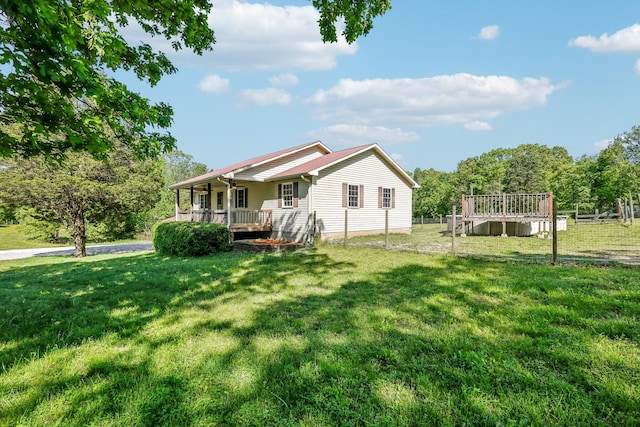 46 Seay Ln, Erin, TN 37061 - rear view of property with a yard and a porch