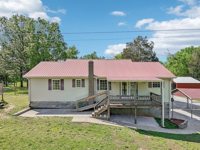 46 Seay Ln, Erin, TN 37061 - view of front of property featuring a front lawn, metal roof, and covered porch