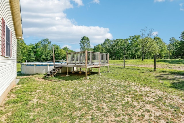 46 Seay Ln, Erin, TN 37061 - view of grassy yard with an outdoor pool and a deck
