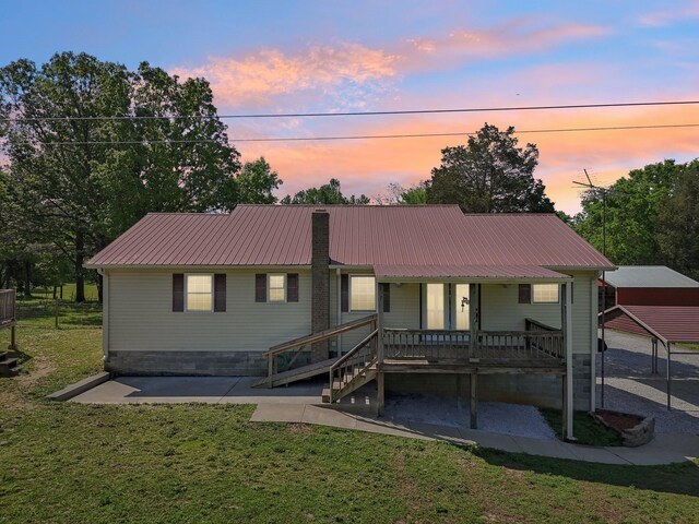 46 Seay Ln, Erin, TN 37061 - view of front of home with a lawn, metal roof, and a porch