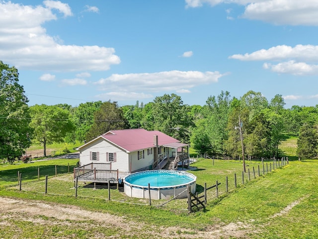 46 Seay Ln, Erin, TN 37061 - view of swimming pool with a wooden deck, stairway, and a view of trees