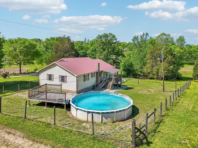 46 Seay Ln, Erin, TN 37061 - view of pool featuring a wooden deck, a wooded view, and stairway