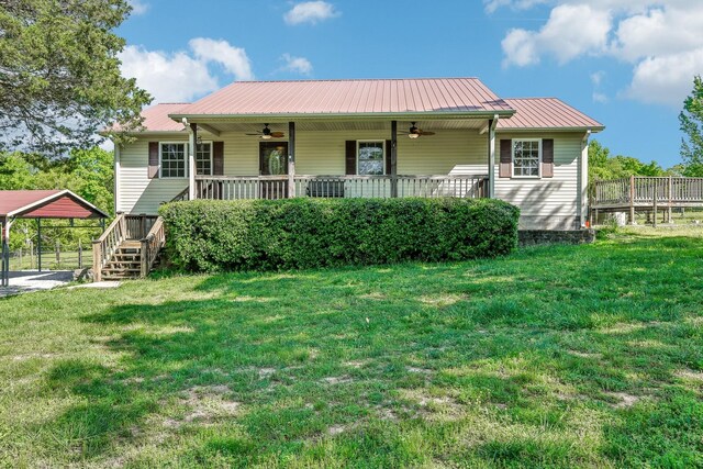 46 Seay Ln, Erin, TN 37061 - view of front of home featuring a ceiling fan, a front yard, a carport, and metal roof
