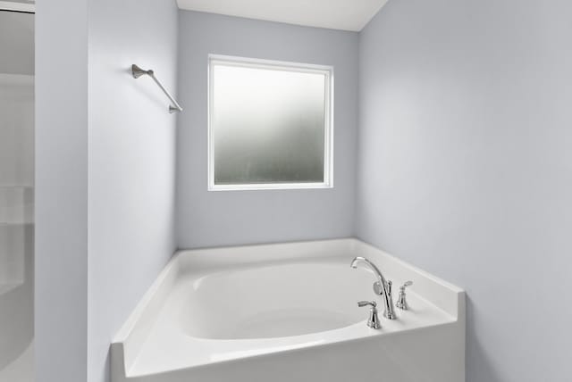 bathroom featuring a garden tub