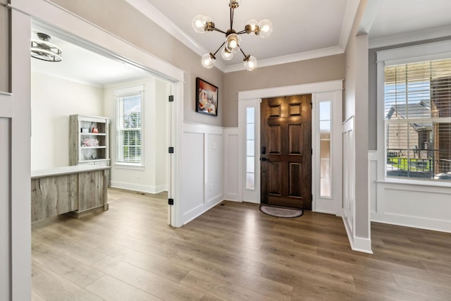 9015 Grayson Cir, Mount Juliet, TN 37122 - foyer entrance featuring ornamental molding, a chandelier, a decorative wall, wood finished floors, and wainscoting