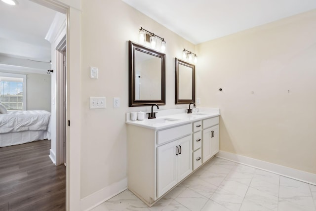 9015 Grayson Cir, Mount Juliet, TN 37122 - ensuite bathroom featuring double vanity, baseboards, and marble finish floors