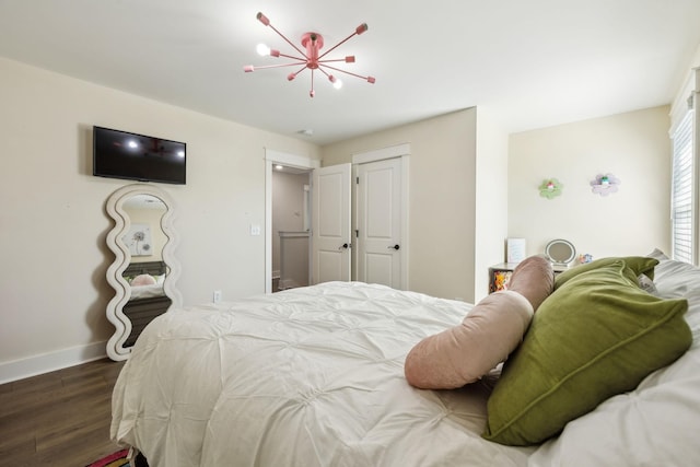 9015 Grayson Cir, Mount Juliet, TN 37122 - bedroom featuring wood finished floors, baseboards, and a chandelier