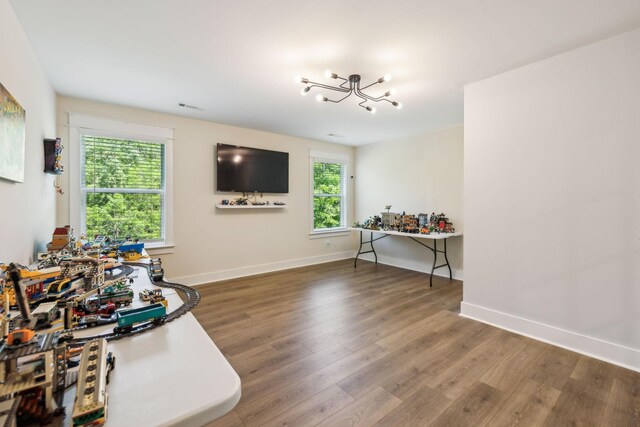 9015 Grayson Cir, Mount Juliet, TN 37122 - living area with a chandelier, wood finished floors, and baseboards