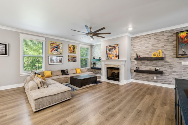 9015 Grayson Cir, Mount Juliet, TN 37122 - living area featuring ceiling fan, baseboards, a fireplace, plenty of natural light, and crown molding