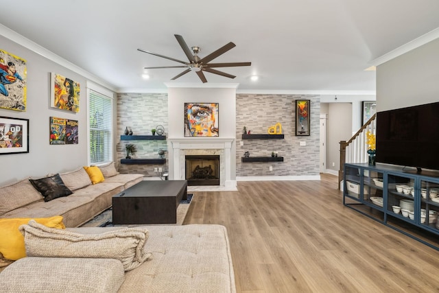 9015 Grayson Cir, Mount Juliet, TN 37122 - living room featuring a ceiling fan, crown molding, a fireplace with flush hearth, wood finished floors, and stairway