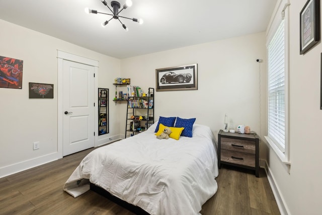 9015 Grayson Cir, Mount Juliet, TN 37122 - bedroom with wood finished floors, multiple windows, and a chandelier