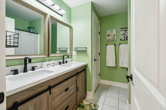 9015 Grayson Cir, Mount Juliet, TN 37122 - full bathroom featuring marble look tile flooring, double vanity, and baseboards
