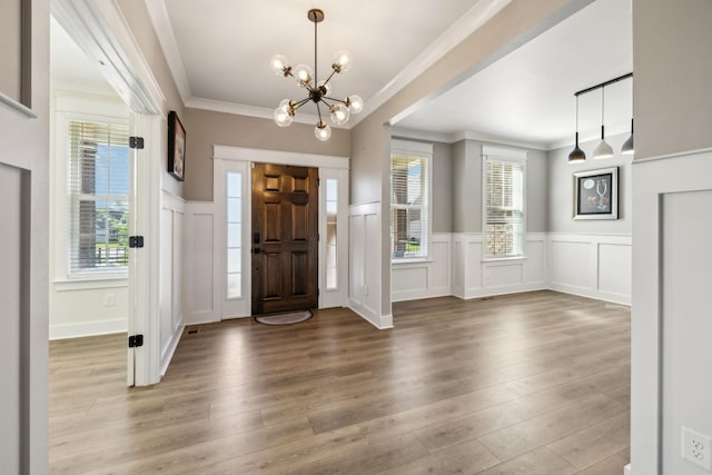 9015 Grayson Cir, Mount Juliet, TN 37122 - foyer entrance with a chandelier, wood finished floors, a decorative wall, ornamental molding, and wainscoting
