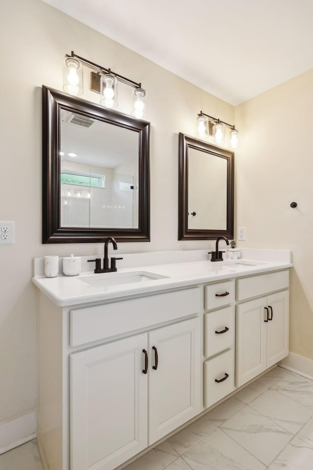 9015 Grayson Cir, Mount Juliet, TN 37122 - bathroom featuring marble finish floors, double vanity, and baseboards