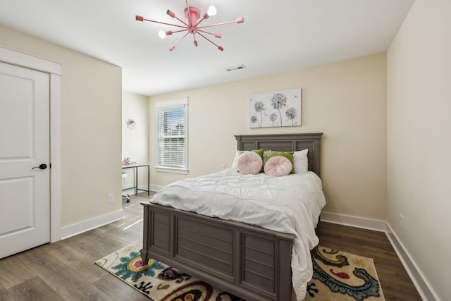 9015 Grayson Cir, Mount Juliet, TN 37122 - bedroom featuring wood finished floors, baseboards, and a chandelier