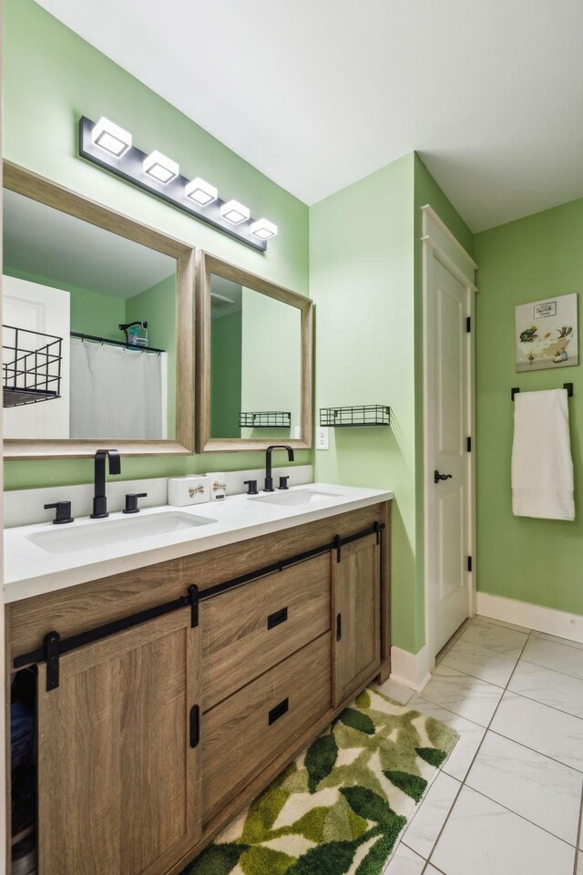 9015 Grayson Cir, Mount Juliet, TN 37122 - bathroom featuring double vanity, baseboards, and tile patterned floors