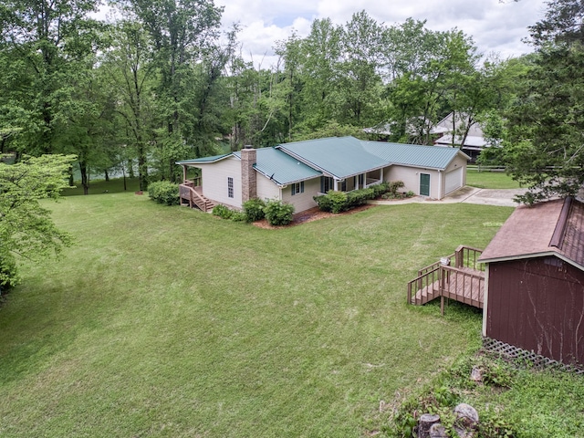 490 Luckey Ln, Sparta, TN 38583 - view of green lawn featuring concrete driveway and a garage