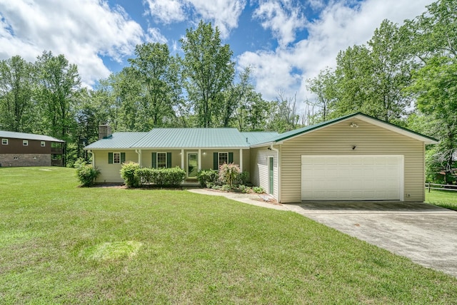 490 Luckey Ln, Sparta, TN 38583 - ranch-style home featuring a garage, concrete driveway, a chimney, metal roof, and a front yard