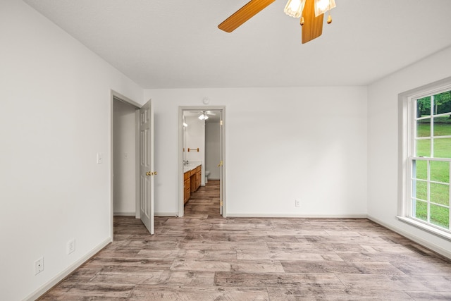 490 Luckey Ln, Sparta, TN 38583 - empty room featuring a ceiling fan, plenty of natural light, light wood finished floors, and baseboards