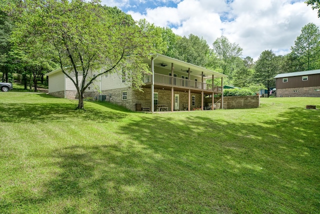 490 Luckey Ln, Sparta, TN 38583 - back of property with ceiling fan, a lawn, and a deck