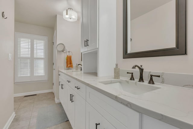 1186 Peebles Dr, Smyrna, TN 37167 - full bathroom with baseboards, double vanity, and tile patterned flooring
