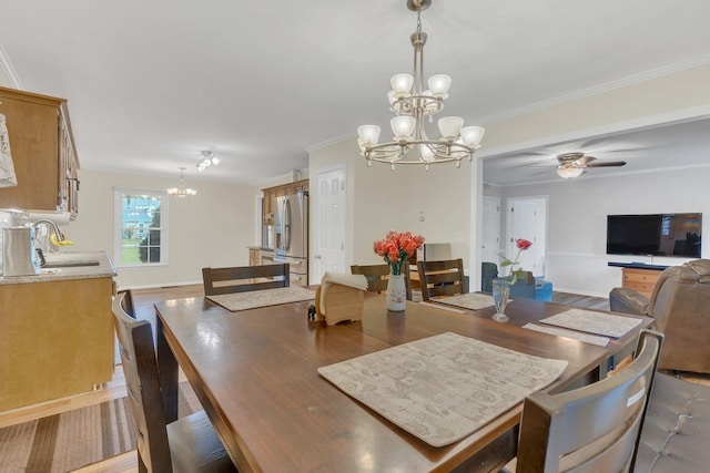 1186 Peebles Dr, Smyrna, TN 37167 - dining space with a chandelier, a ceiling fan, ornamental molding, and dark wood-style flooring