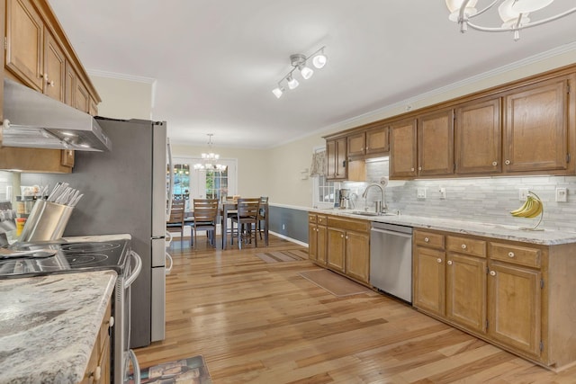 1186 Peebles Dr, Smyrna, TN 37167 - kitchen with a chandelier, stainless steel appliances, under cabinet range hood, a sink, and crown molding