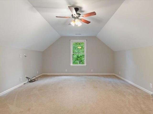 3904 Rowland Rd, Murfreesboro, TN 37128 - additional living space featuring light carpet, vaulted ceiling, a ceiling fan, and baseboards