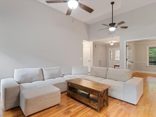 3904 Rowland Rd, Murfreesboro, TN 37128 - living area featuring ceiling fan, light wood-style floors, high vaulted ceiling, and baseboards