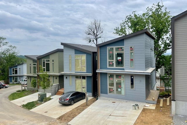 view of front of house featuring concrete driveway