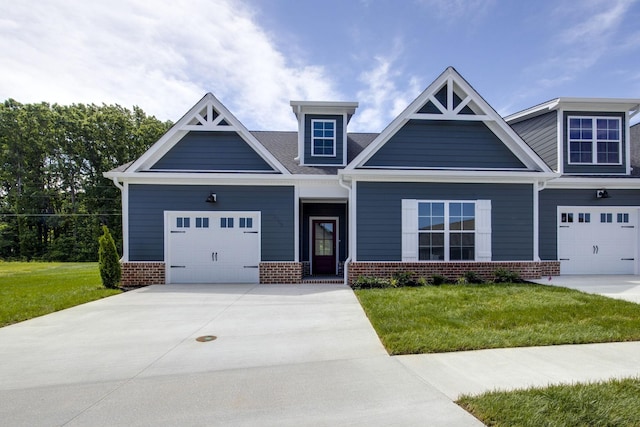 2033 Rylee Way, Greenbrier, TN 37073 - craftsman-style home featuring brick siding, a front lawn, and concrete driveway