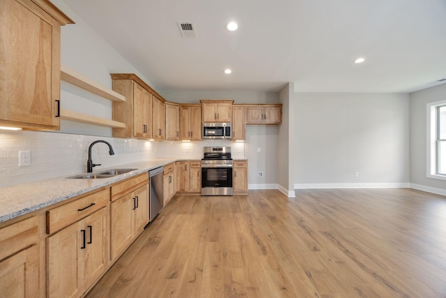 2060 Rylee Way Unit 54, Greenbrier, TN 37073 - kitchen with appliances with stainless steel finishes, a sink, open shelves, decorative backsplash, and recessed lighting