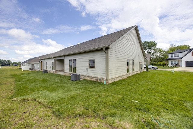 2050 Rylee Way, Greenbrier, TN 37073 - view of home's exterior featuring cooling unit, a lawn, and roof with shingles
