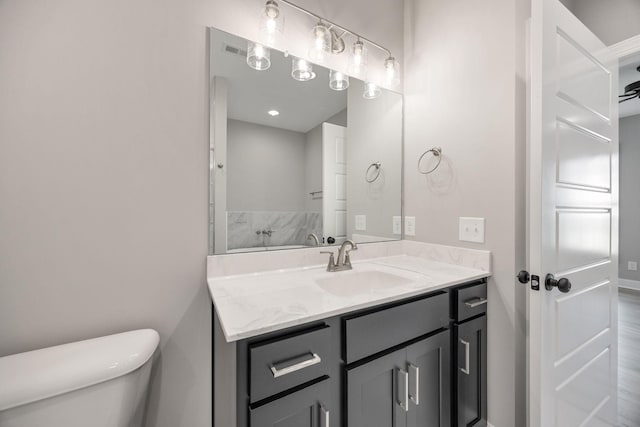 2050 Rylee Way, Greenbrier, TN 37073 - bathroom with toilet, vanity, wood finished floors, and baseboards