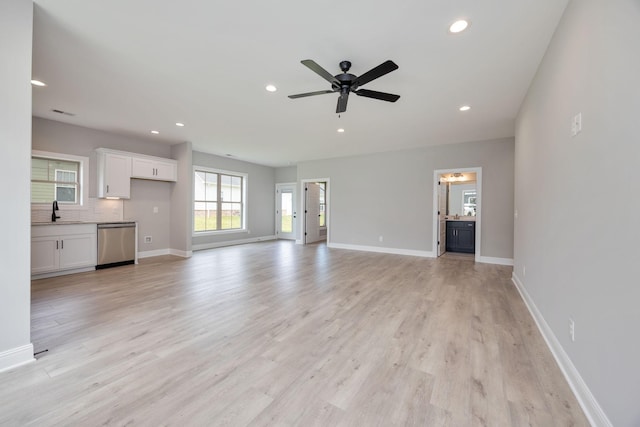 2050 Rylee Way, Greenbrier, TN 37073 - unfurnished living room featuring a sink, recessed lighting, light wood-style flooring, baseboards, and ceiling fan