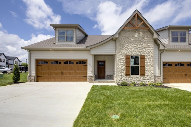 2050 Rylee Way, Greenbrier, TN 37073 - craftsman-style home with stone siding, concrete driveway, and a front yard