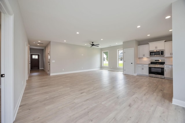 2050 Rylee Way, Greenbrier, TN 37073 - unfurnished living room featuring a ceiling fan, recessed lighting, baseboards, and light wood-type flooring