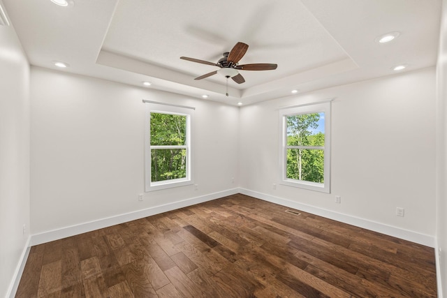 5706 Wilder Rd S, Grimsley, TN 38565 - unfurnished room featuring a raised ceiling, healthy amount of natural light, recessed lighting, dark wood-style flooring, and ceiling fan